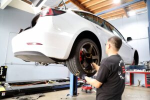 Wilson at P3X Performance Upgrading the suspension of this Tesla Model 3 Performance to Mountain Pass Performance Sports Coilovers